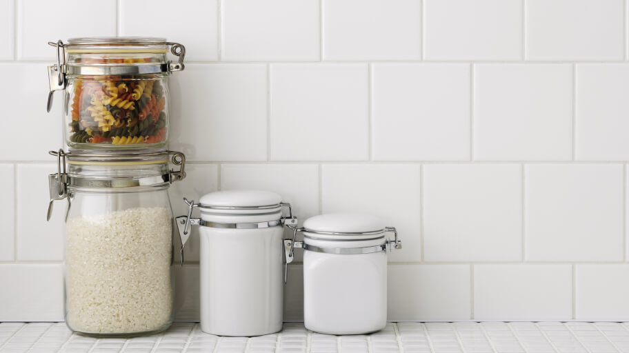 Kitchen counter and a clean white tiled wall