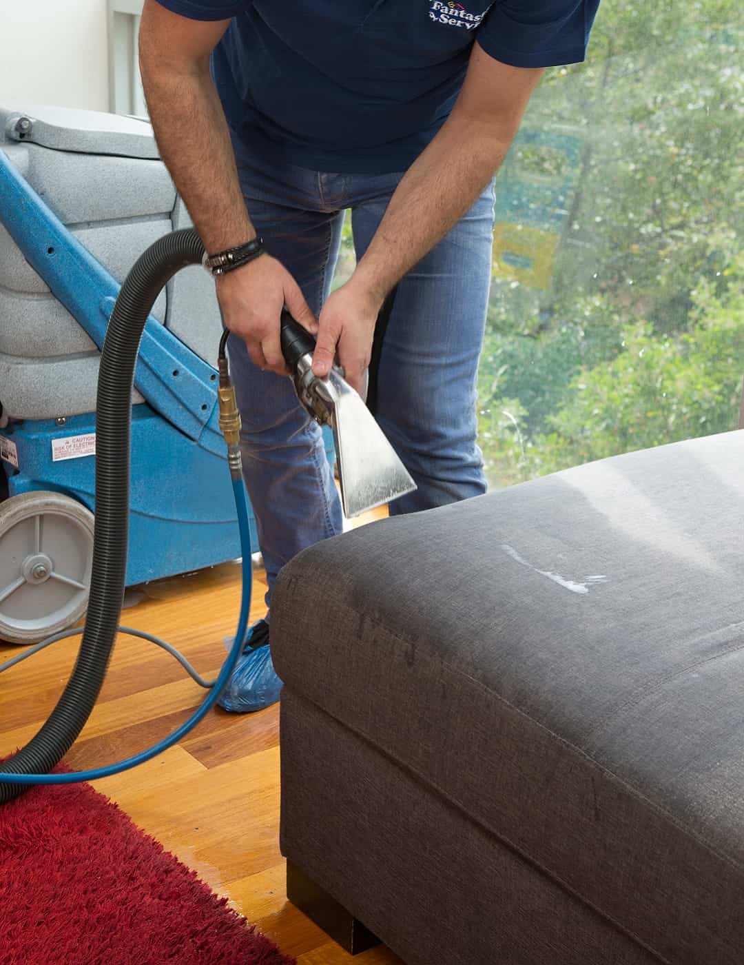Professional upholstery cleaning with a machine