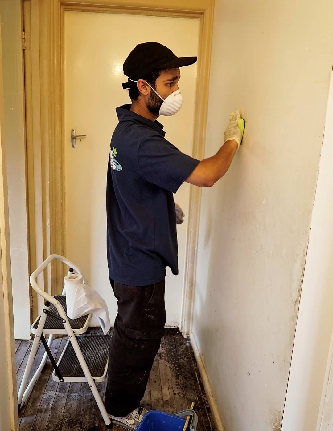 Cleaning professional performing wall cleaning service