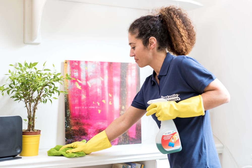 ndis one-off cleaning lady wiping down a counter
